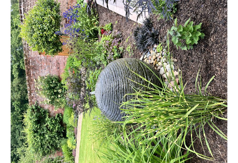 Cottage Garden Gin Terrace - Wymondham  - Planting and Water Feature were designed to complement the existing garden planting.