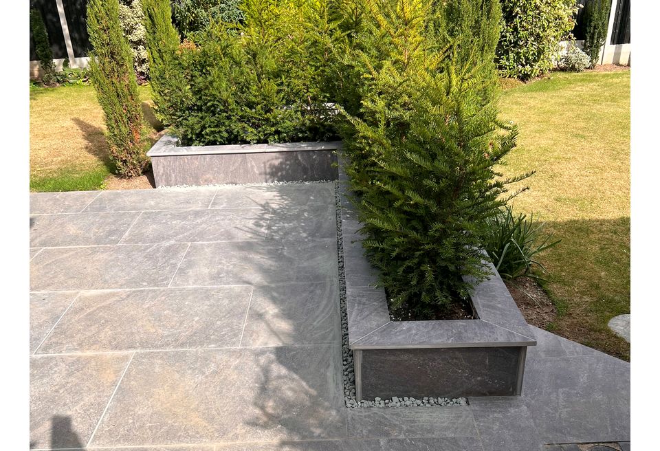 Large Wrap around Patio - Wymondham  - Porcelain faced planters with porcelain capping