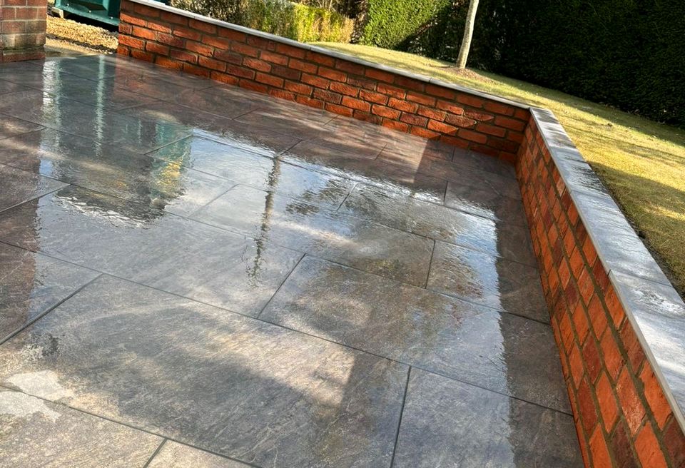 Large Wrap around Patio - Wymondham  - Porcelain wall capping finished level with the lawns